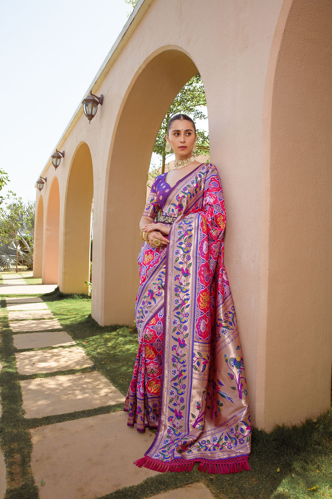 Purple Indian saadi with Paithani-style border and zari work, ideal for elegant wedding celebrations and festive occasions.