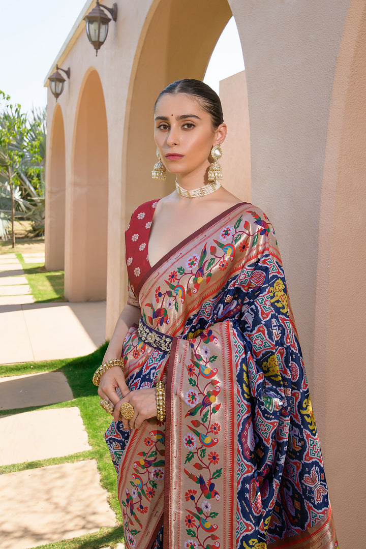 Beautiful Navy-blue saree with Paithani-style border and intricate meena and zari patterns, perfect for festive wear.