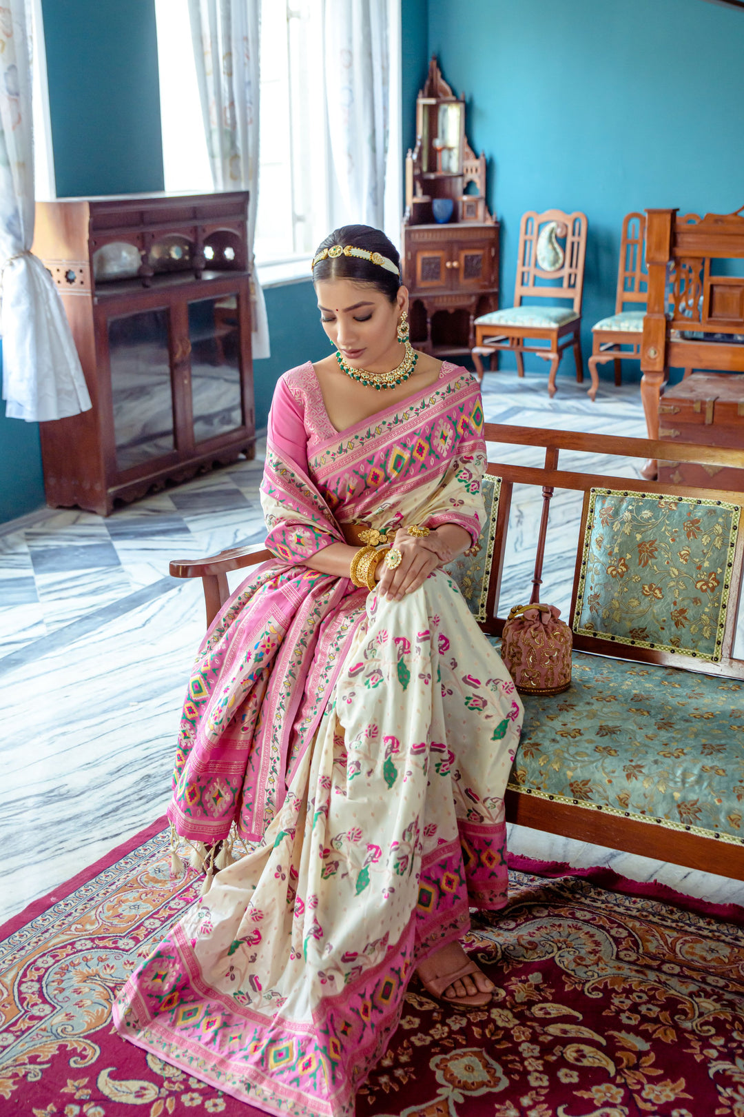 Luxurious Off-white Indian saree with exquisite meena and zari patterns, perfect for special occasions.