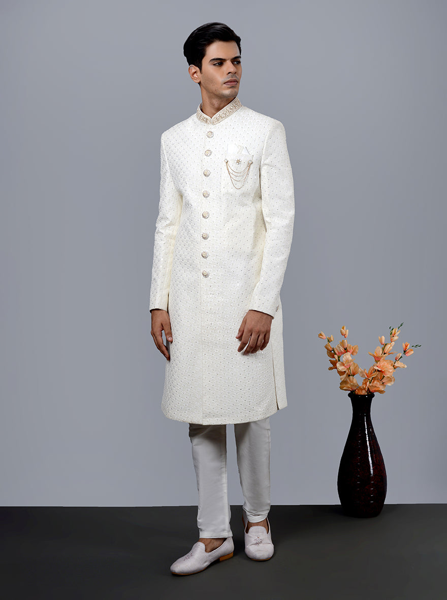 Elegant cream sherwani for men, perfect for grooms in the USA, with intricate thread and diamond work.