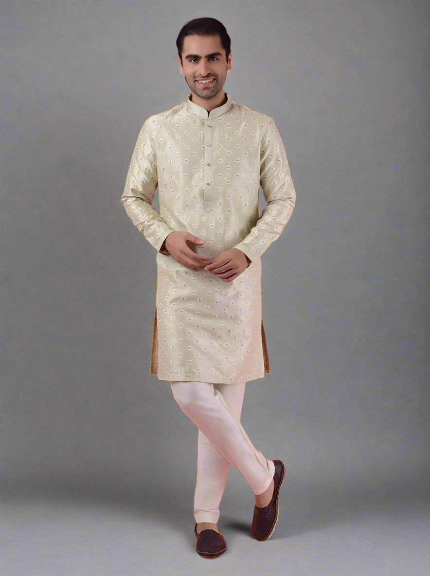 Stylish pista green kurta pajama for men with intricate embroidery, perfect for festive wear.