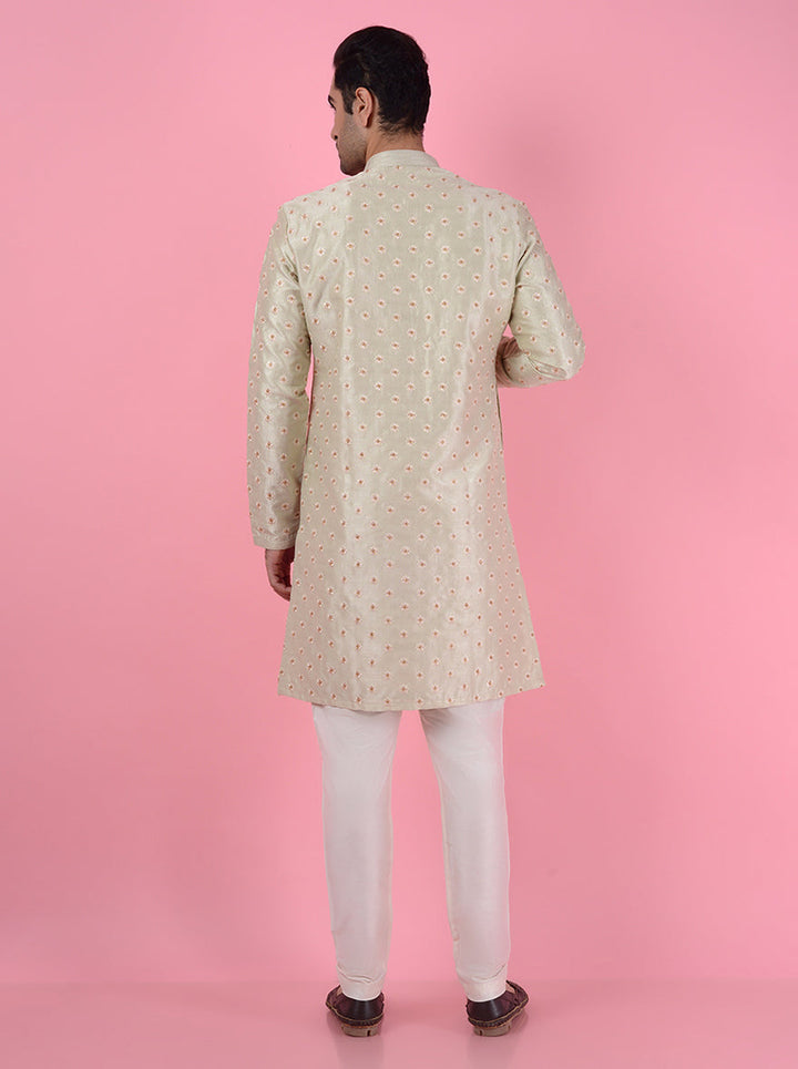 Embrace style with this pista kurta pajama, featuring intricate embroidery for a sophisticated look.