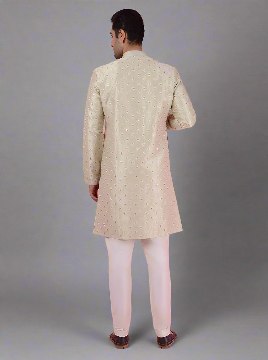 Traditional pista green kurta pajama with embroidery for men, perfect for ethnic occasions.