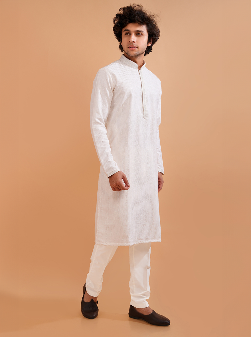 Men’s cream silk blend kurta pajama set, offering a refined look for weddings and celebrations.