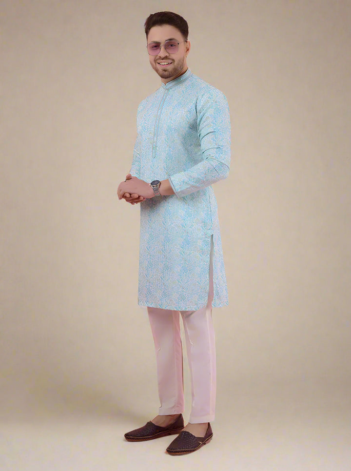 Perfect for haldi ceremonies, this aqua blue and white kurta pajama offers sophistication and charm for special occasions.