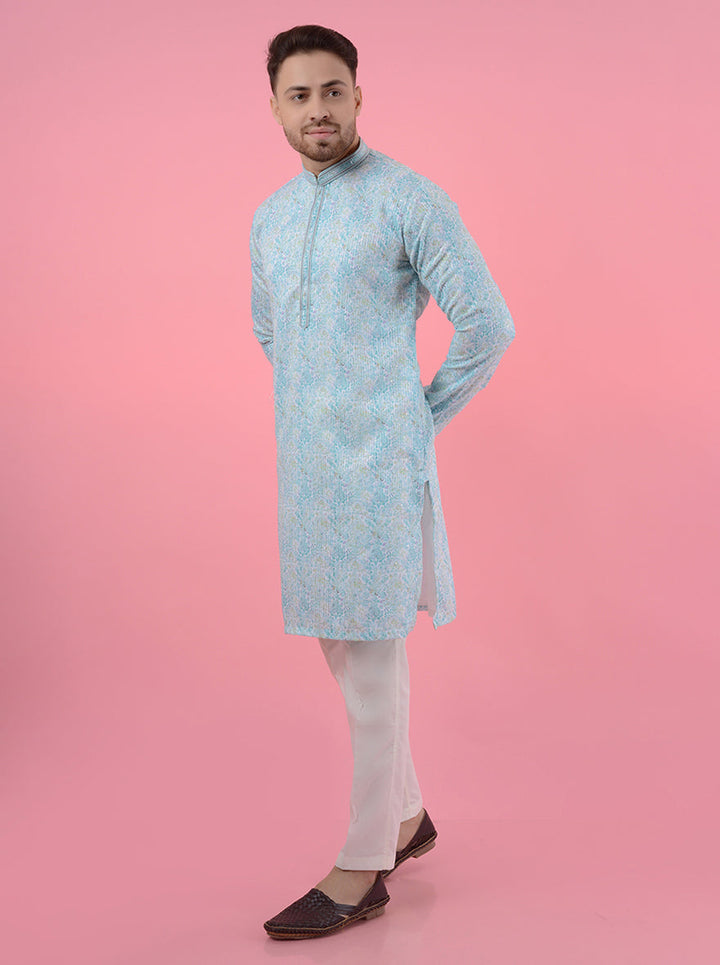 Discover the elegance of this aqua blue and white kurta pajama, crafted for modern men celebrating traditional events.