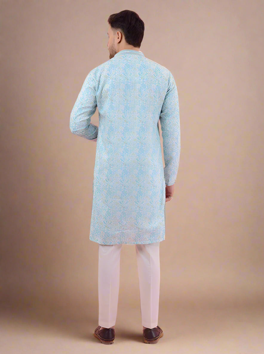 Stand out in style with this beautifully embroidered aqua blue and white kurta pajama for festive gatherings in the USA.