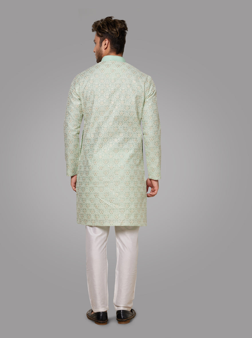 Make an impression at gatherings with this elegant light pista green kurta pajama set.