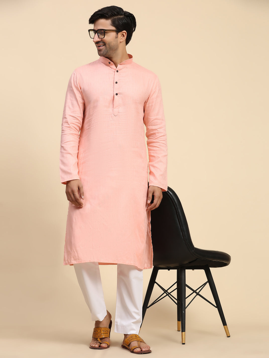 Men’s baby pink kurta pajama set with full-weaved embroidery for a traditional look.