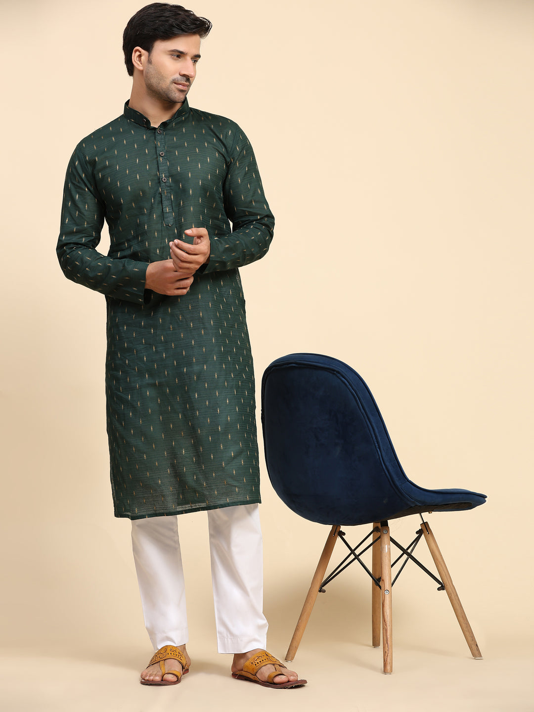 Luxurious dark green cotton kurta pajama set for traditional occasions.