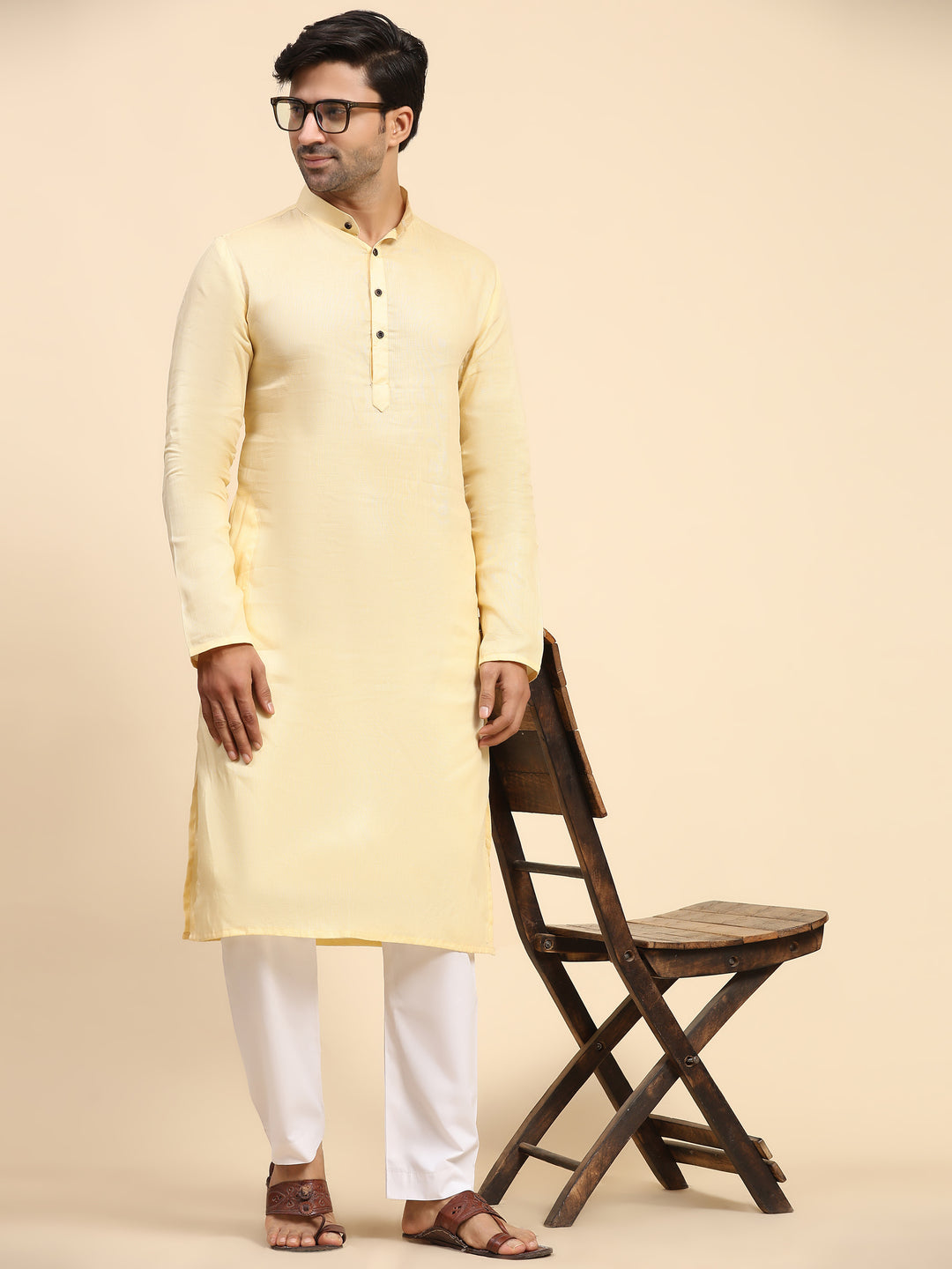 Premium creamish yellow kurta pajama for men, designed with elegant embroidery and pure cotton.