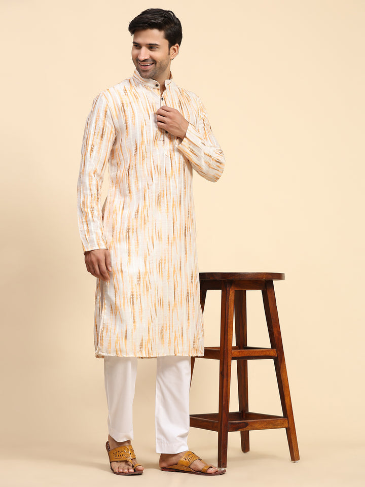 Radiant yellow kurta pajama set for men with playful tie-dye design for Haldi.