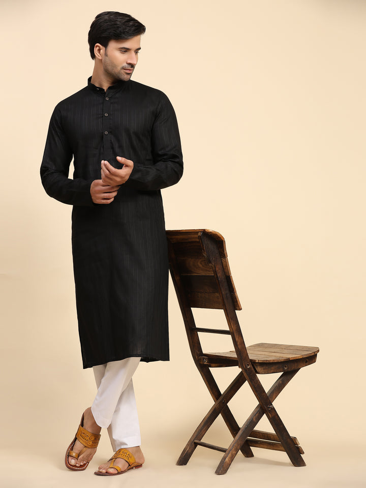 Sophisticated black kurta pajama for men with a handwoven touch, ensuring luxury and comfort for festive and wedding occasions.