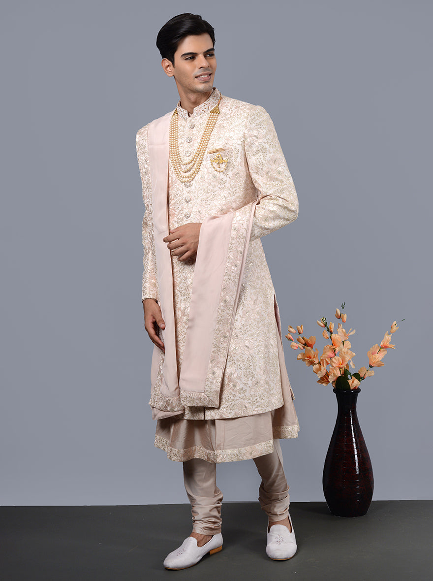 Discover the perfect pink sherwani for grooms, crafted from luxurious silk blend fabric.