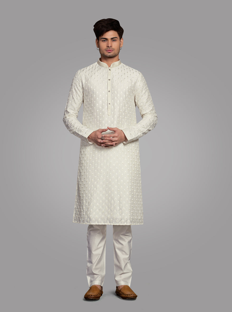 Comfortable Cream Kurta Pajama made from silk blend, perfect for showcasing elegance at special occasions.