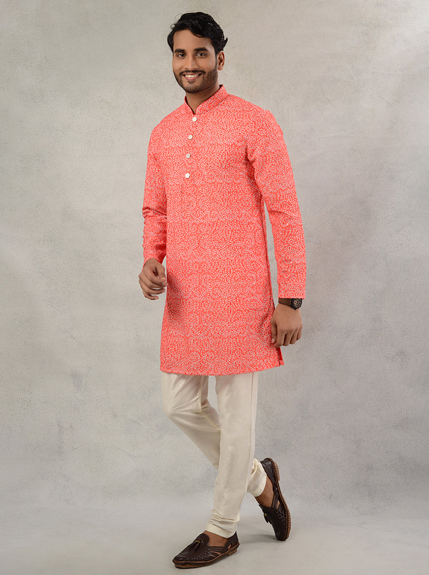 Men's orange silk blend kurta pajama with printed and embroidered design.