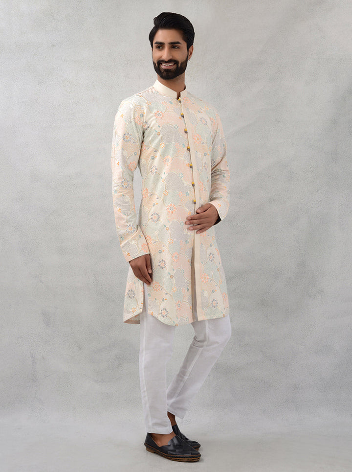 Celebrate in comfort with our beige kurta pajama crafted from silk and cotton for modern men.