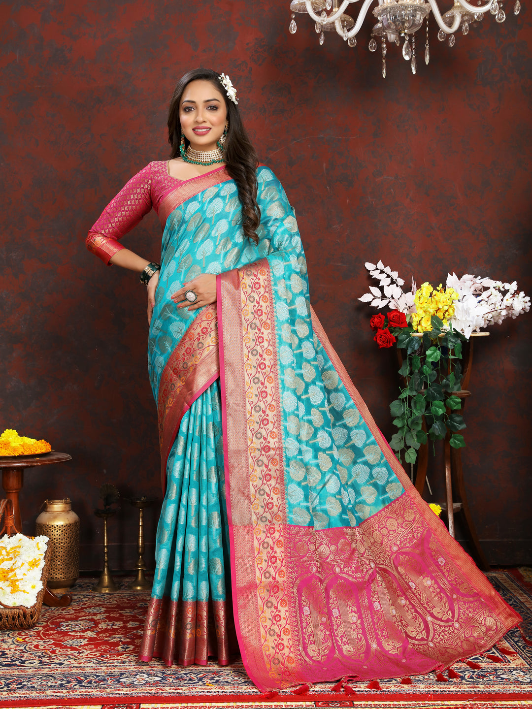 Designer turquoise Organza silk saree with stunning Meenakari weaving, perfect for weddings and ceremonies.