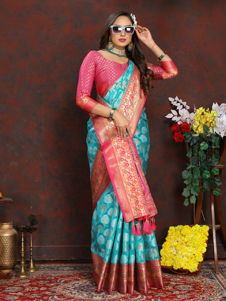 Classic turquoise Meenakari Organza silk saree with exquisite detailing, ideal for festive gatherings.