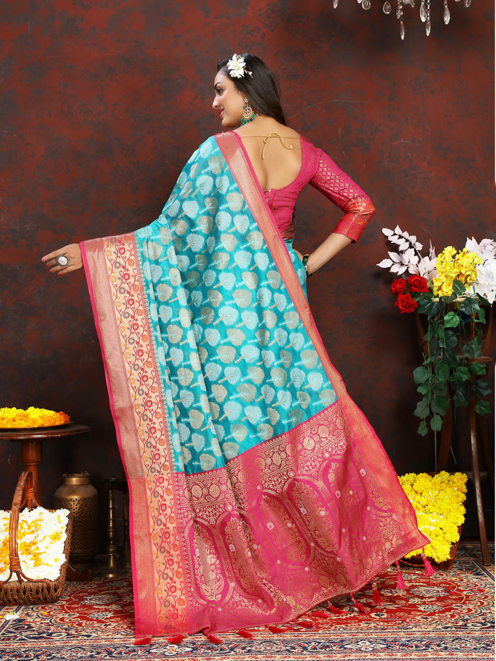 Turquoise Organza silk saree with rich Meenakari patterns, perfect for traditional Indian occasions.