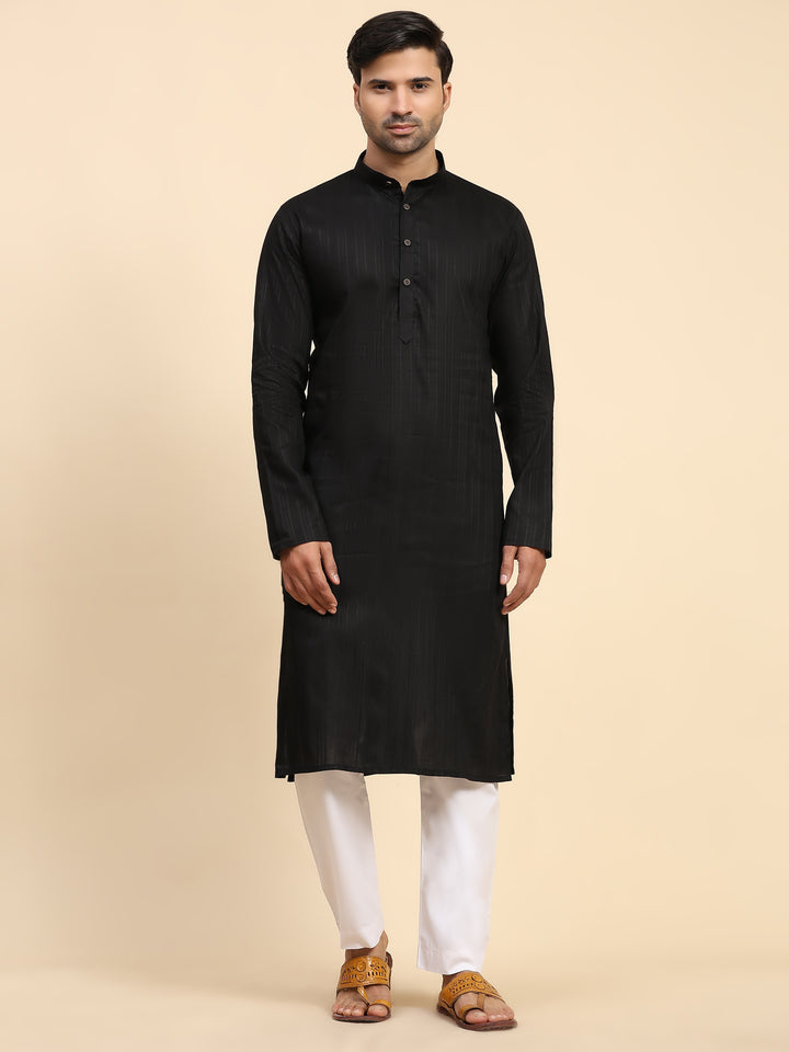 Elegant black men's kurta pajama set with handwoven details, perfect for weddings and festivals in traditional Indian style.