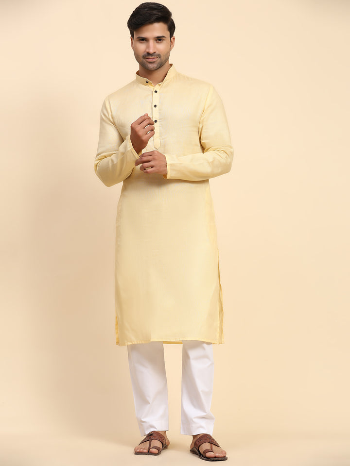 Elegant creamish yellow kurta pajama set for men, perfect for Haldi ceremonies and festivals.