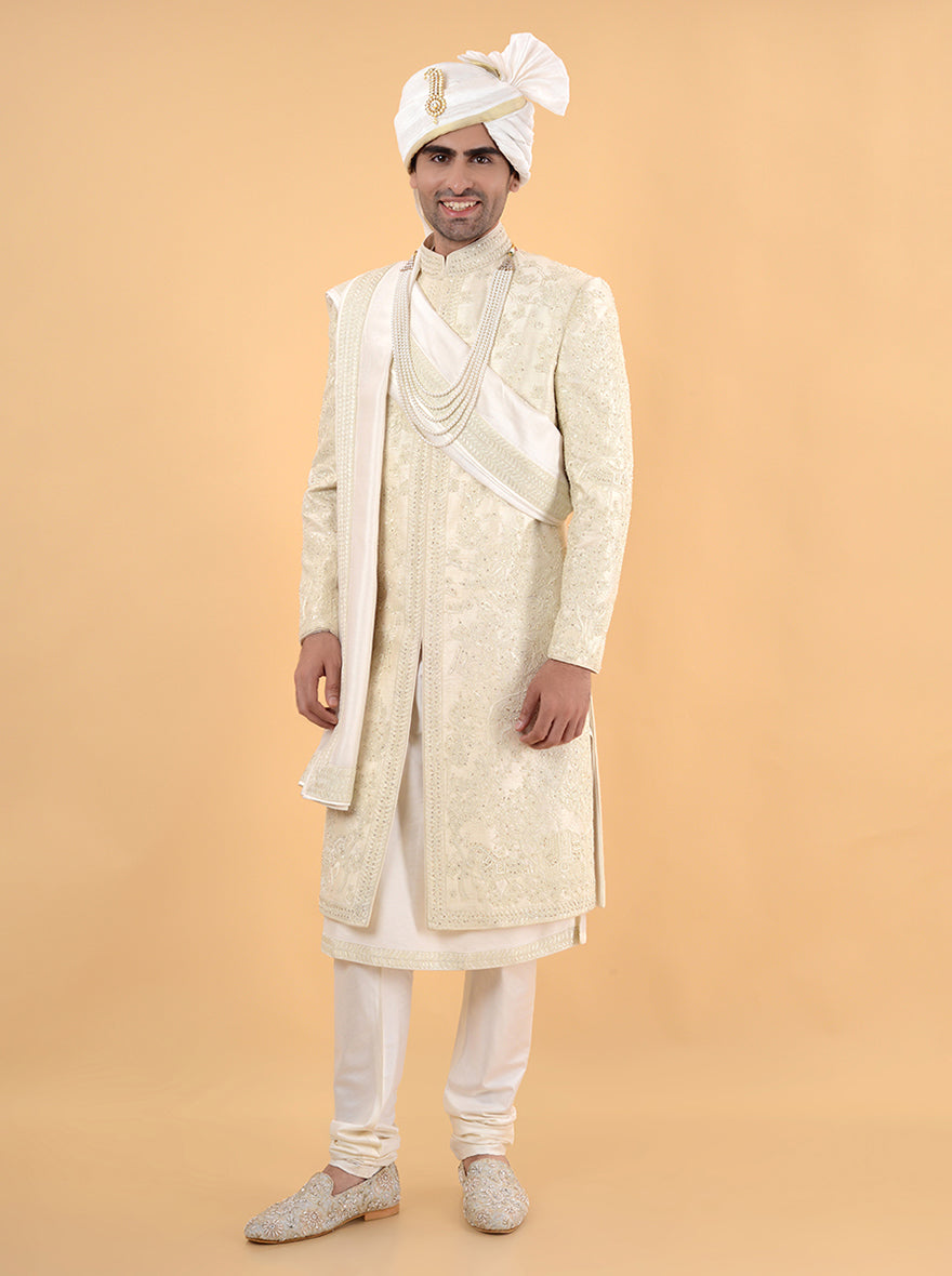 Embrace tradition with this Cream Silk Sherwani, showcasing exquisite dori and bead work, making it perfect for weddings in the USA. This designer piece ensures you shine on your special day.