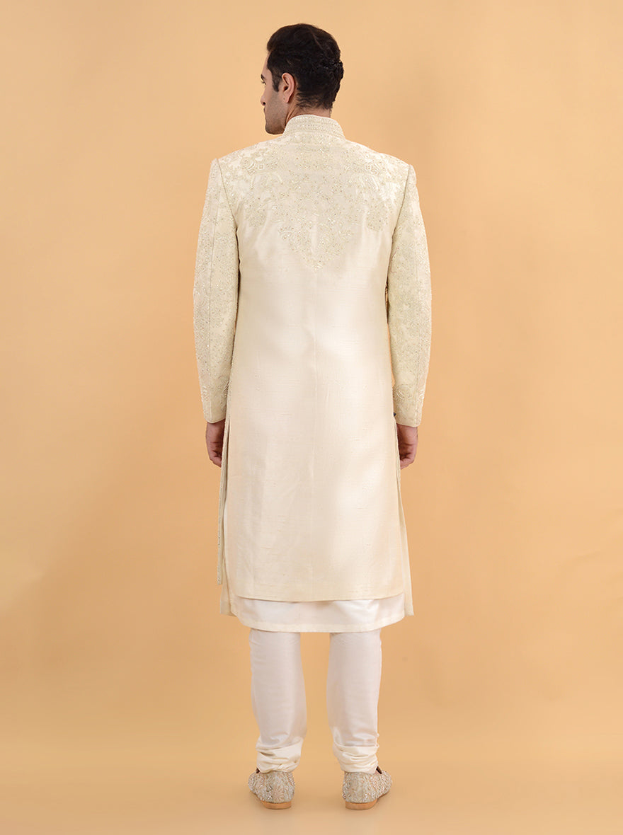 Step into elegance with this Cream Silk Sherwani, featuring intricate dori and bead work, ideal for grooms celebrating their weddings in the USA.