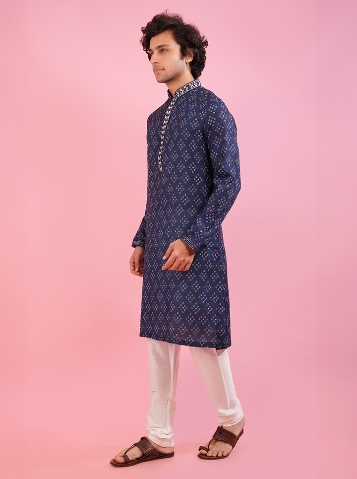 Men’s blue silk kurta pajama set, featuring detailed embroidery for weddings and festivals.