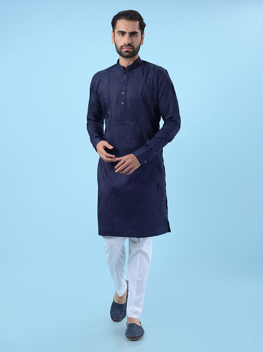 Navy blue kurta pajama set for men with festive embroidery, perfect for cultural events.