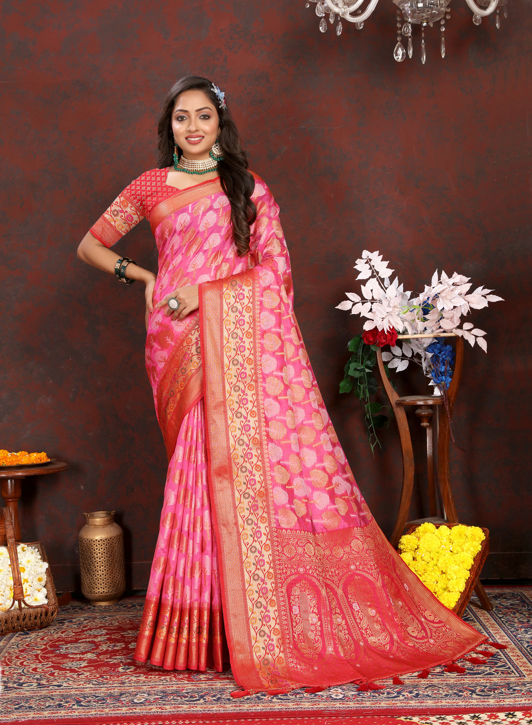 Elegant coral pink Organza silk saree with luxurious Meenakari designs, perfect for Indian weddings.