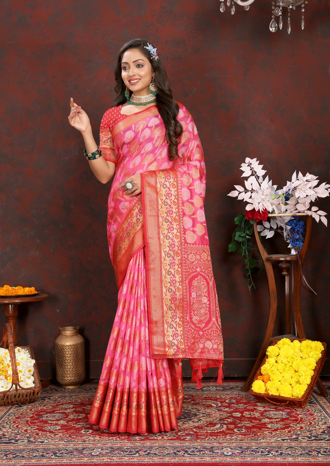 Designer coral pink Organza silk saree featuring exquisite Meenakari details, ideal for cultural gatherings.