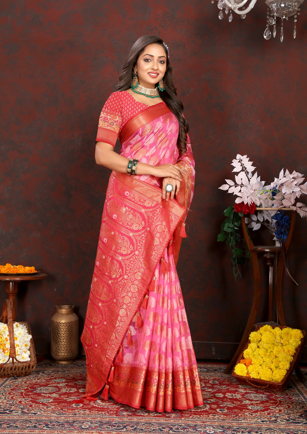 Coral pink Organza silk saree with rich Meenakari weave, ideal for traditional events.