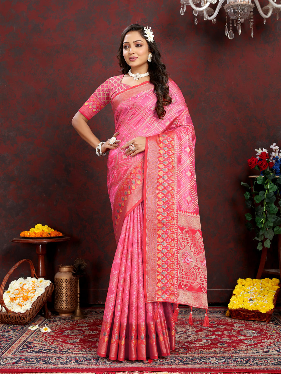 Elegant coral pink Organza silk saree with zari weaving and intricate Meenakari pallu, perfect for celebrations.