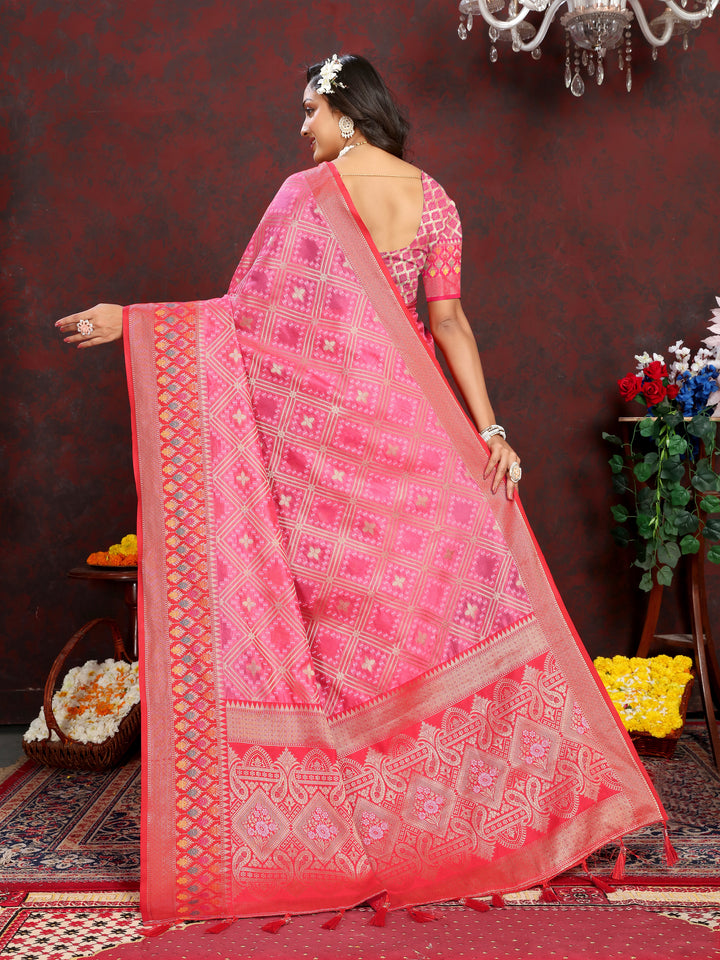 Coral pink Organza silk saree with exquisite zari and Meenakari pallu, ideal for Indian ceremonies.