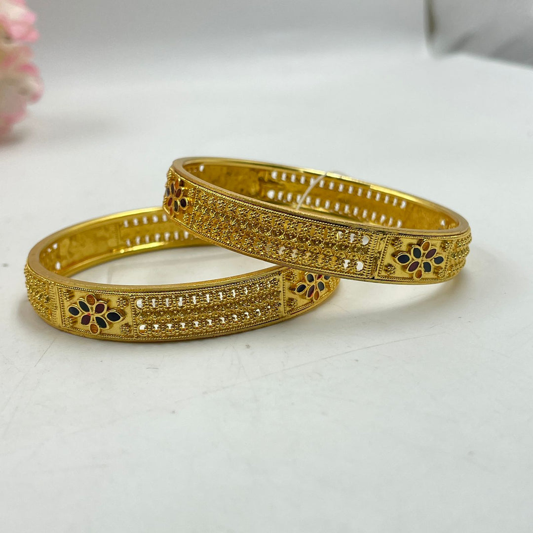 Unique golden bangles with personalized designs for a special touch.