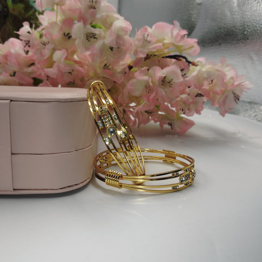 Vibrant golden bangles perfect for a fun night out.