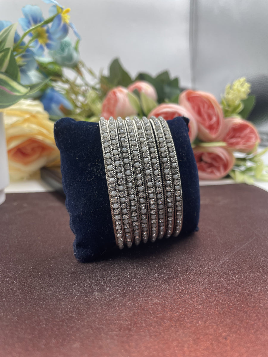 Exquisite silver diamond bangle featuring stunning diamond accents, perfect for elevating any outfit with a touch of elegance.