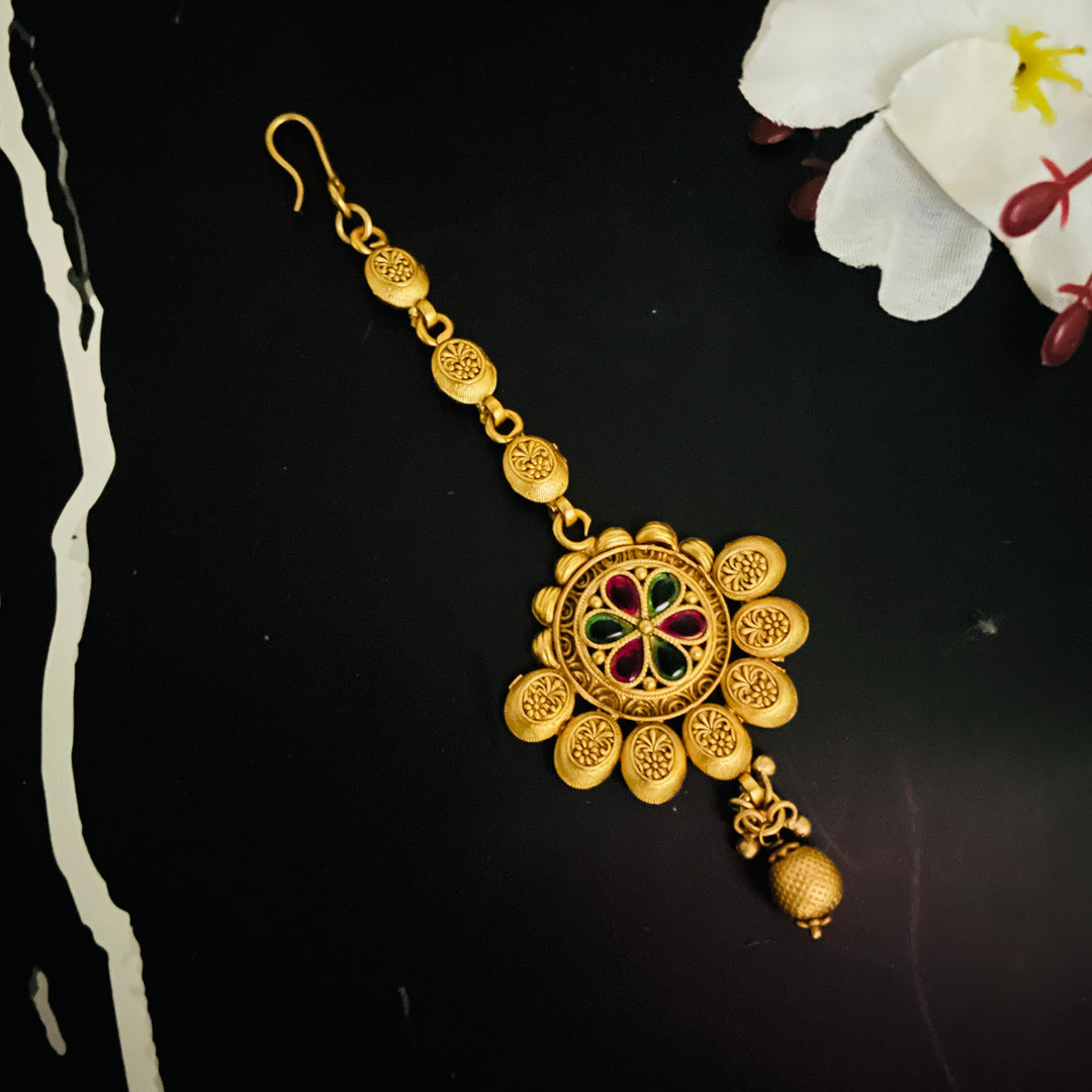 Luxurious gold tika perfect for brides seeking a sophisticated wedding accessory.