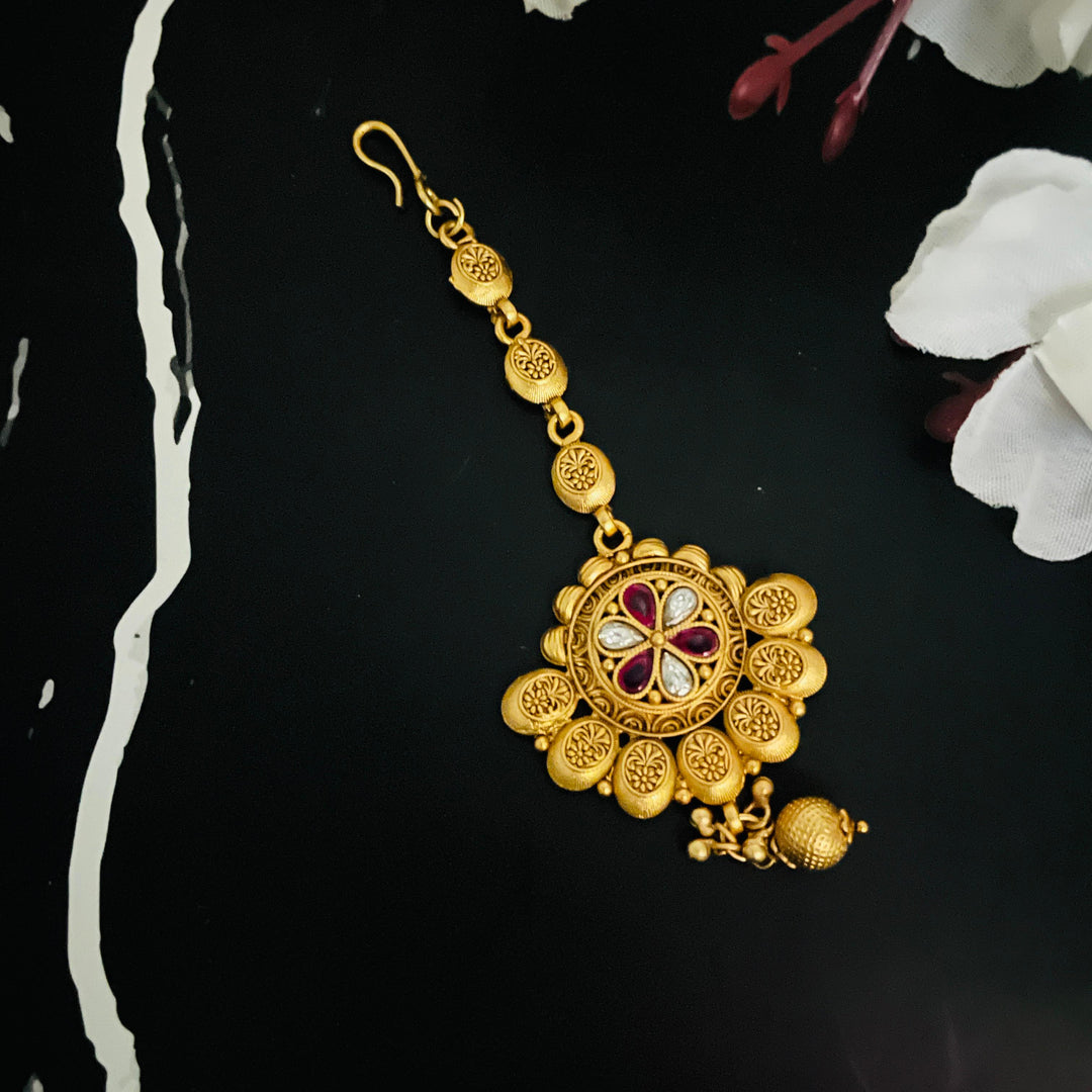 Elegant gold tika showcasing exquisite craftsmanship, perfect for modern brides.