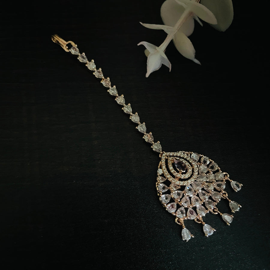 Stunning rose gold mang tika adorned with intricate patterns, ideal for celebrations.