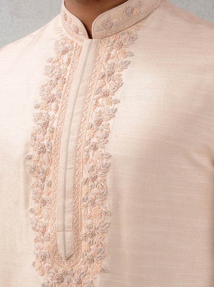 Embroidered peach silk kurta pajama, ideal for celebrations