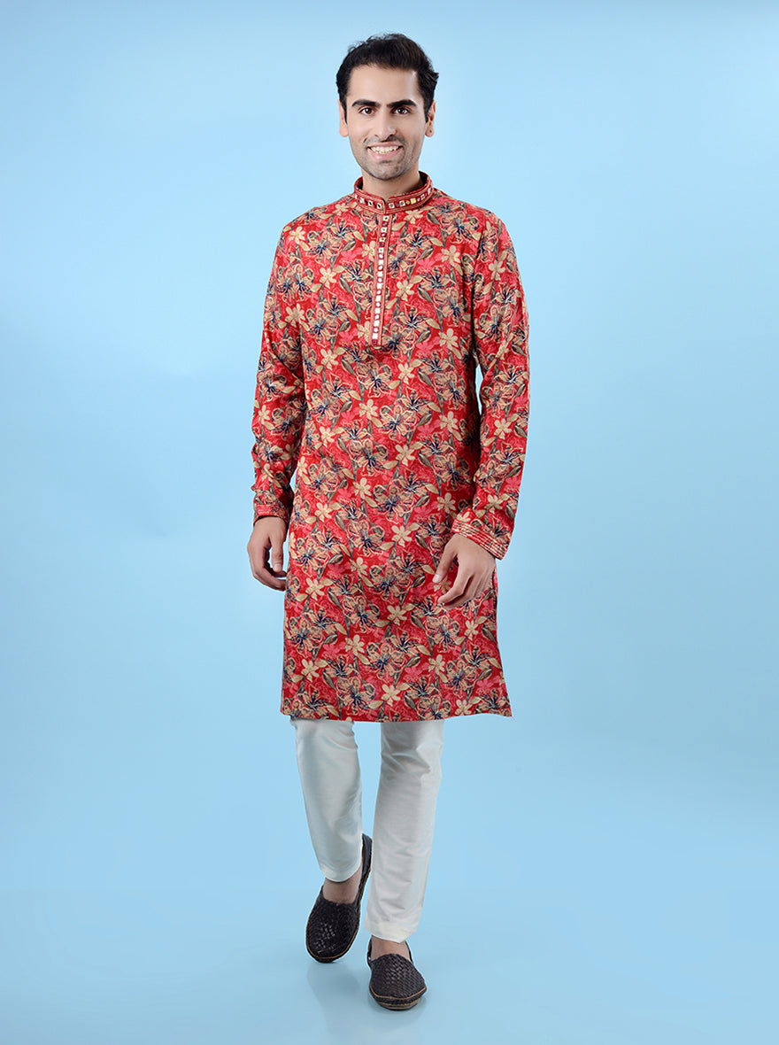 Men's red kurta pajama set, crafted with ethnic prints and mirror work for festive and cultural events.