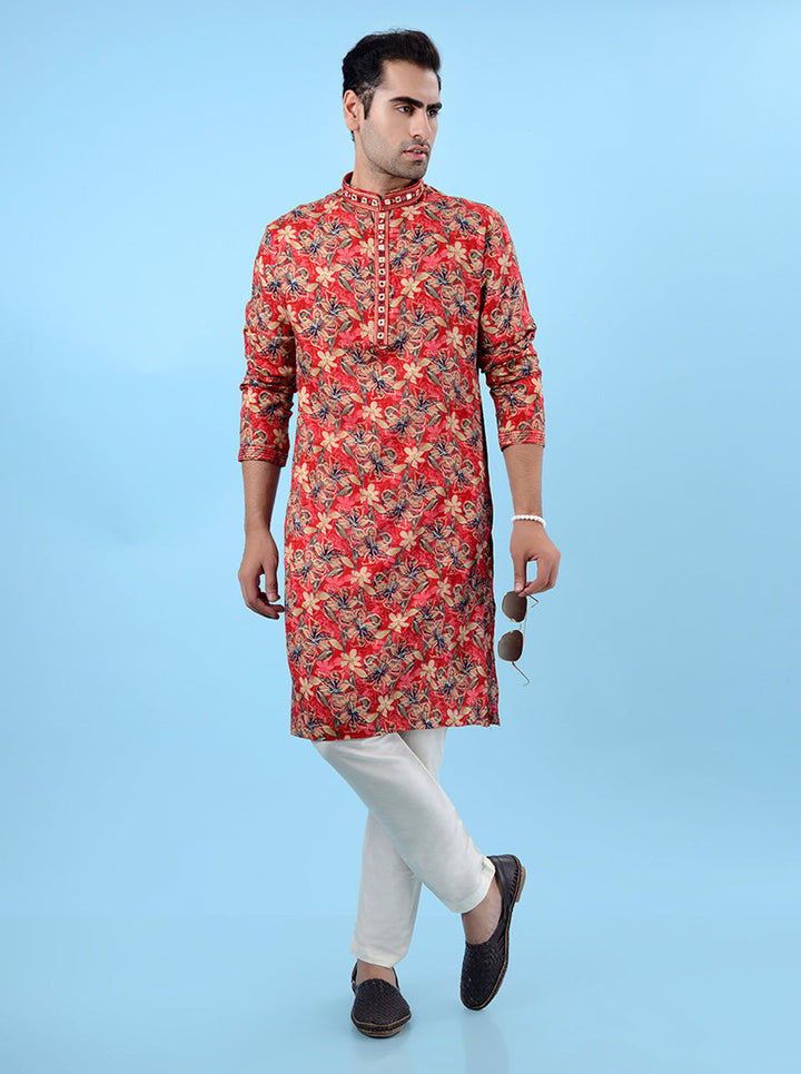 Red kurta pajama for men, adorned with ethnic prints and mirror work for a perfect festive appearance.