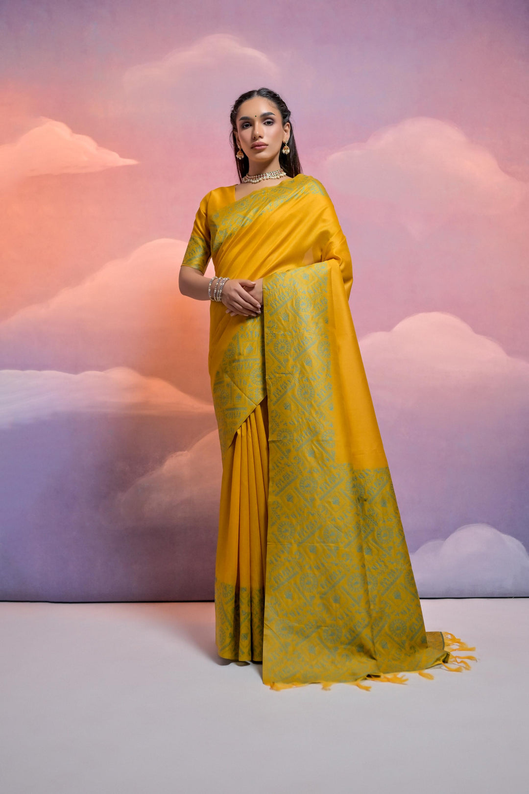 Soft raw silk saree with Warli-inspired pallu and contrasting border