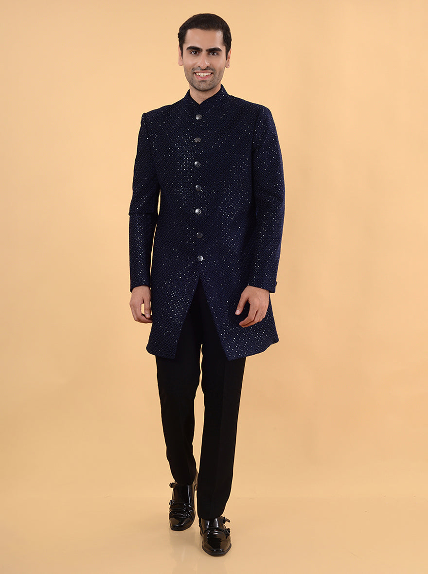 Experience luxury with our Velvet Blue Indo Western outfit, featuring intricate embroidery and a Mandarin collar.