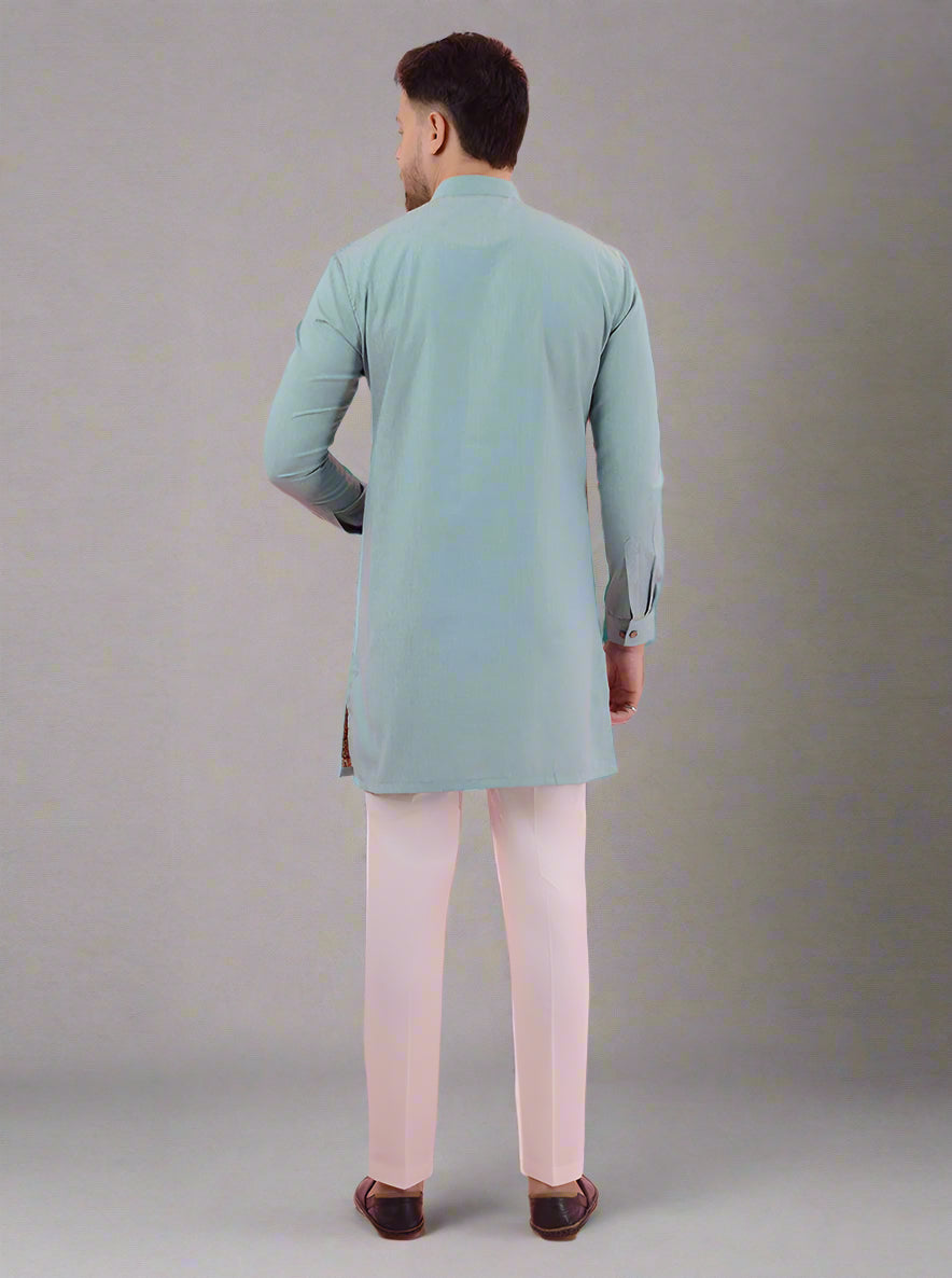 Sea green ethnic kurta pajama for men, designed with a mandarin collar for traditional occasions.