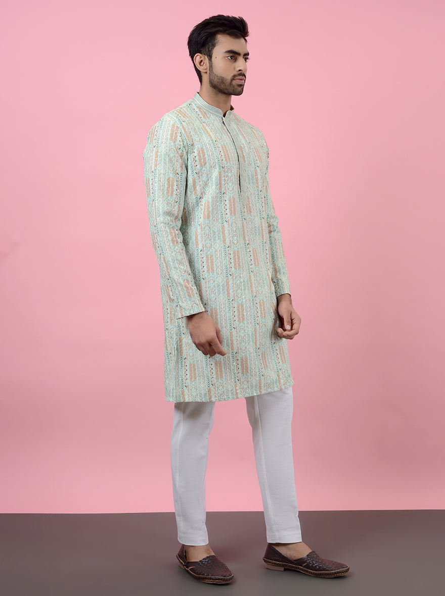 Elegant pista green kurta pajama, showcasing traditional design elements.