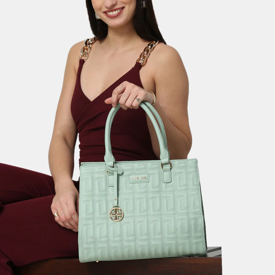 The Lavie Luxe Mint Satchel features a premium quilted pattern, perfect for adding a stylish touch to any outfit.