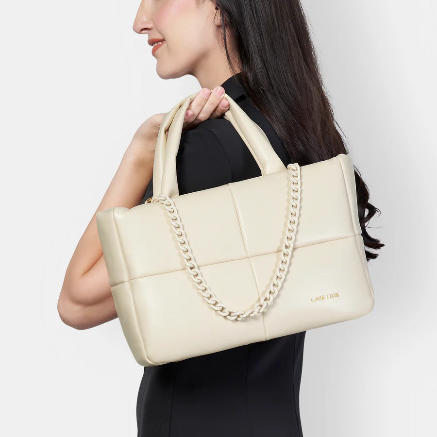 Discover the Lavie Luxe Puff Off White Small Tote, designed for versatility with adjustable straps and ample pockets for essentials.